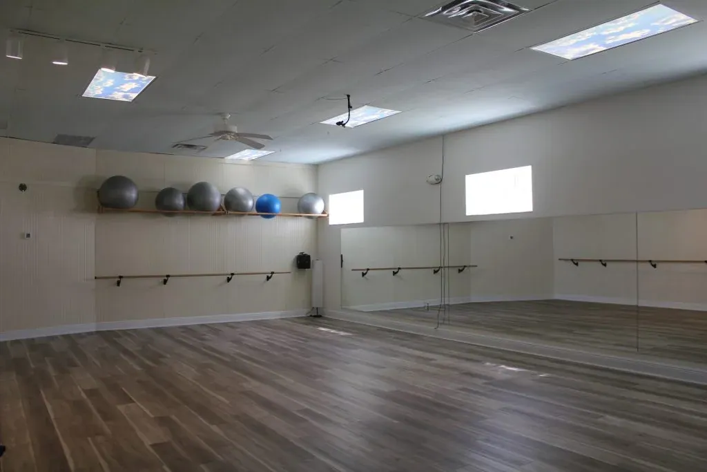 The empty studio, morning light on the wood floor